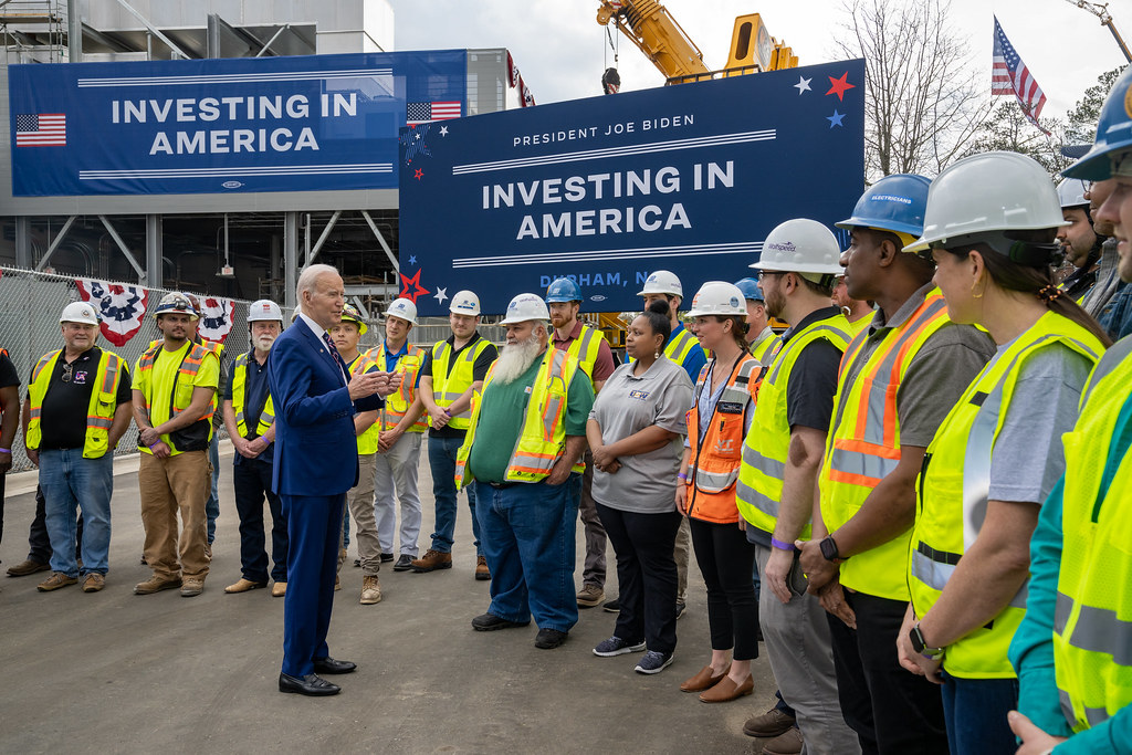 President Joe Biden speaks with workers at a semiconductor manufacturing facility in North Carolina.